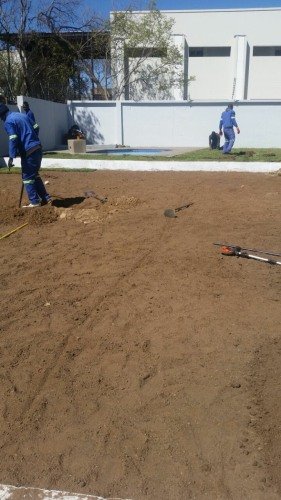 Preparing a lawn area next to a pool